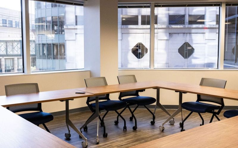 Conference room at McCormick Law & Consulting set for a business acquisition negotiation